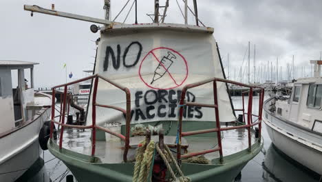 No-Forced-Vaccines-Sign-Draped-Across-A-Docked-Boat
