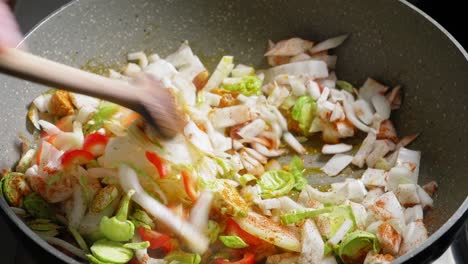 Cooking-And-Stirring-Chopped-Vegetables-And-Chicken-Breast-Seasoned-With-Spices