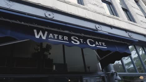 Water-st-cafe-in-Gastown-Vancouver-BC-front-entrance-cloth-awning-steady-slow-motion-tilting-left