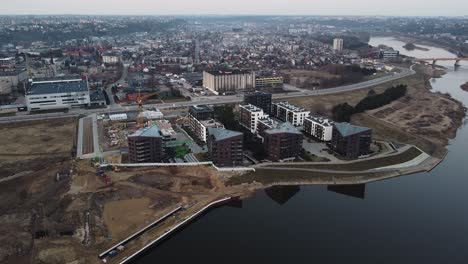 Beautiful-modern-new-apartment-buildings-on-riverside-in-Kaunas-city,-aerial-view