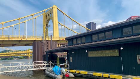 City-of-Pittsburgh-River-Safety-Center-in-Pittsburgh,-Pennsylvania-with-Roberto-Clemente-bridge-in-the-background