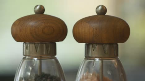 Two-isolated-wooden-and-crystal-spice-jars