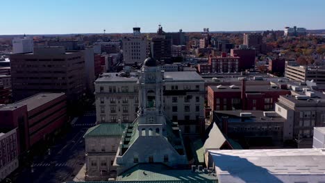 Drone-orbiting-the-steeple-of-City-Hall-in-Portland,-Maine-with-the-city-in-the-background