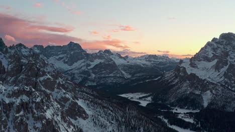 Establishing-drone-shot-of-Misurina-Valley-at-sunset-in-the-winter