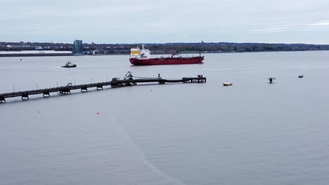 Silver-Rotterdam-oil-petrochemical-shipping-tanker-leaving-Tranmere-terminal-Liverpool-aerial-view-descending