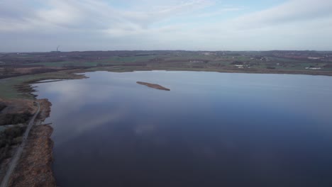 High-Level-Drone-Footage-of-Scandinavian-Lake-in-Winter-Landscape---Dolly-In-Shot