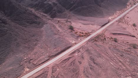 Aerial-shot-of-a-beautiful-colorful-desert-road
