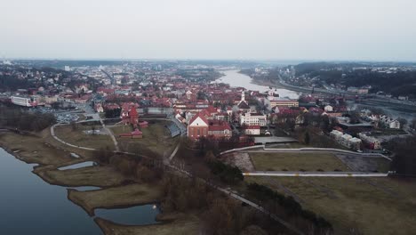 Majestic-red-rooftops-of-Kaunas-old-town-in-flying-forward-aerial-view