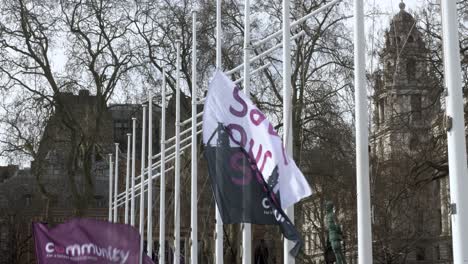 Save-Out-Steel-Flag-Banner-Moving-In-Wind-At-Parliament-Square-On-17-March-2022