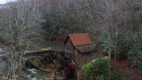 Glade-Creek-Grist-Mill-in-West-Virginia-with-bridge-and-drone-video-pulling-out