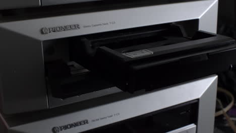 Finger-Pressing-Button-On-Pioneer-T-C3-And-Cassette-Desk-Slides-Out