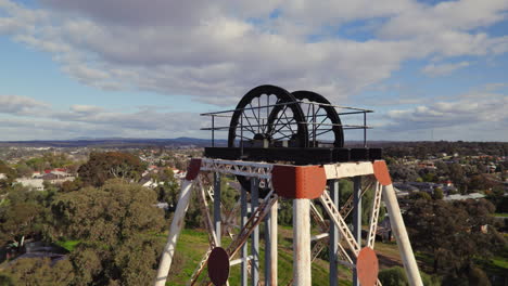 Close-up-circling-drone-shot-of-Victoria-Hill-Mining-Reserve-poppet-head-in-Bendigo