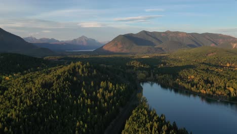 Majestic-Mountains-And-Vast-Forest-Landscape-Of-Lake-five-in-montana--aerial-shot