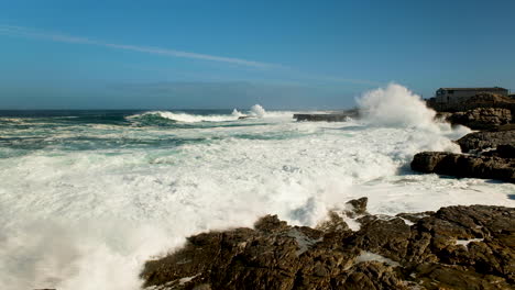 Wave-crashes-and-runs-onto-rocks-of-rocky-coastline