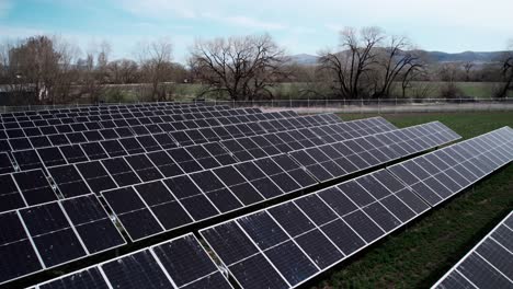 A-rural-solar-powered-green-energy-farm,-renewable,-clean,-carbon-neutral,-aerial