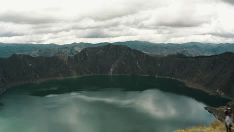Aerial-View-Of-The-Quilotoa-Lake-In-The-Crater-Of-The-Volcano-In-Ecuador---drone-shot