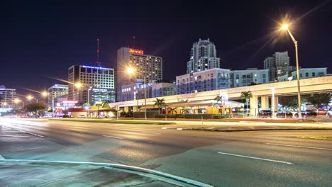 Night-time-lapse-of-traffic-going-past-skyscrapers-on-US1-in-Dadeland-South-Miami-Florida