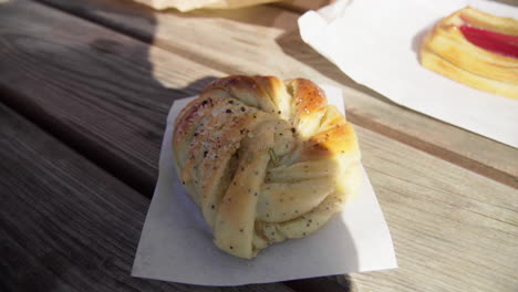 Freshly-baked-cardamom-bun-outside-of-a-cafe-in-Scandinavia