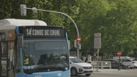 Madrid-public-bus-number-14-driving-passenger-in-downtown,-follow-view