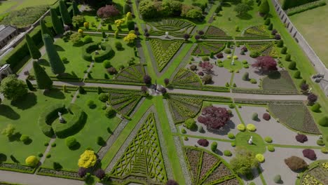 Rotating-Aerial-Shot-of-Perfectly-Kept-Garden-Within-Drummond-Castle,-Scotland