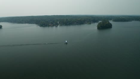 Aerial-panorama,-seaplane-taking-off-from-Balsam-Lake,-Wisconsin