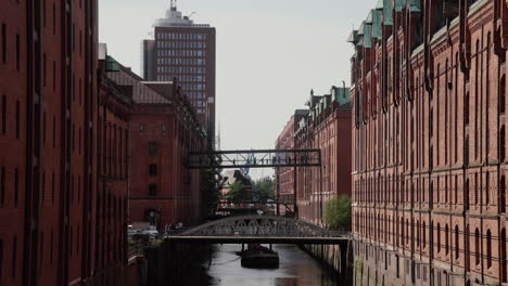 Hamburg-Speicherstadt-Warehouse-District-alongside-Canal-with-old-bridge,-Germany