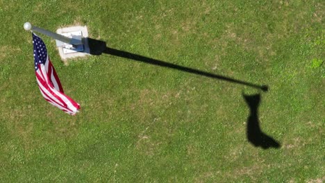 A-top-down-view-of-the-American-flag-blowing-in-the-wind-on-a-sunny-day
