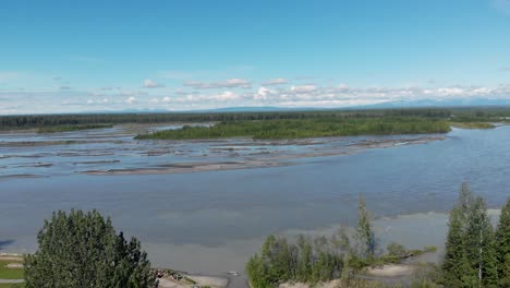 4K-Drone-Video-of-Susitna-River-with-Snow-Covered-Mountain-in-Distance-near-Talkeetna,-AK-on-Summer-Day