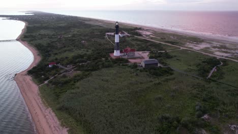 An-aerial-view-of-the-iconic-Fire-Island-Lighthouse-during-a-colorful-sunrise