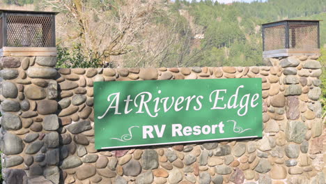 Entrance-sign-for-At-Rivers-Edge-RV-Resort-in-Brookings,-Oregon