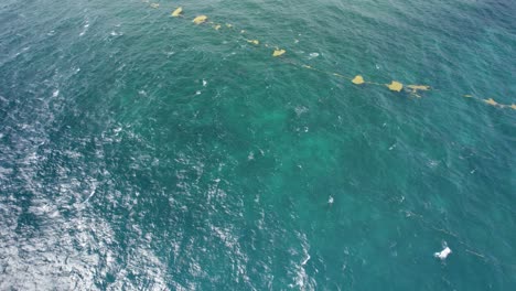 Aerial-revealing-shot-of-the-debris-on-the-sea-surface