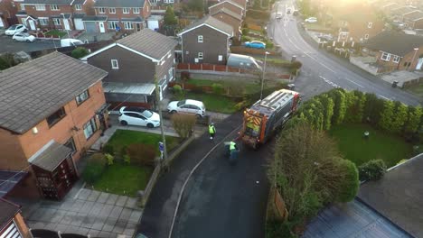 January-201,-Aerial-View,-footage-of-Dustmen-putting-recycling-waste-into-a-garbage-truck,-Bin-men,-refuse-collectors