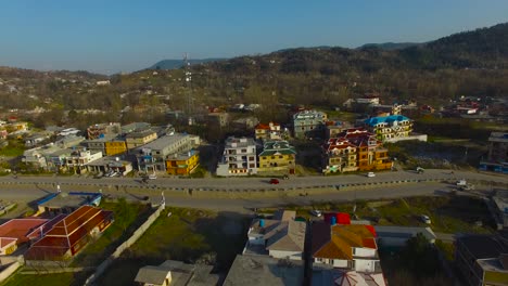 A-city-drone-shot-with-road-and-houses