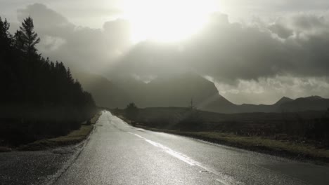 SLOW-MOTION:-Road-Trip-on-a-wet-street-through-the-scottish-highlands