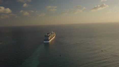 Aerial-view-of-the-cruise-ship-sailing-into-the-big-blue-ocean---still-shot-4K