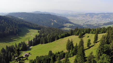 Serene-alpine-pasture-landscape-of-Wildspitz-mountain-in-Switzerland,-aerial