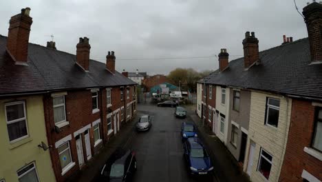 Aerial-footage-of-Oldfield-Street-in-one-of-Stoke-on-Trents-poorer-areas,-Terrace-housing,-poverty-and-urban-decline