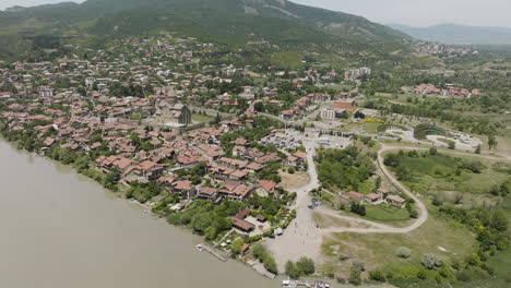 Residential-House-and-Svetitskhoveli-Cathedral-In-Mtskheta-Town-From-Mtkvari-River-In-Georgia