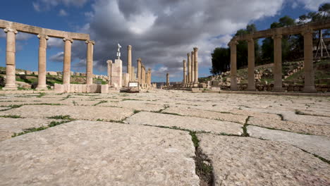 Low-Angle-Shot-of-Forum-Plaza-Stone-Floor-With-Corinthian-Pillars-in-the-Background