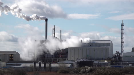 Pollution-billows-out-from-chimneys-at-a-chemical-plant-on-windy-day