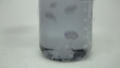 Dry-ice-cube-at-the-bottom-of-a-water-bottle