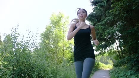 Woman-jogging-on-a-trail-in-a-park