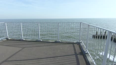 Descend-the-stairs-to-the-observation-deck-overlooking-the-sea