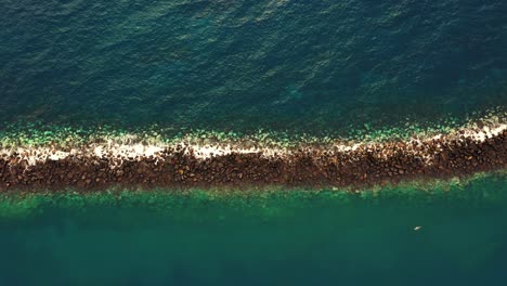 Top-down-aerial-shot,-stunning-seascape-with-turqouise-water-in-Tenerife