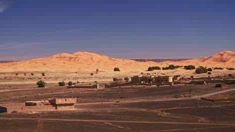 Panning-shot-of-great-sand-dunes-in-Moroccan-desert-Merzouga