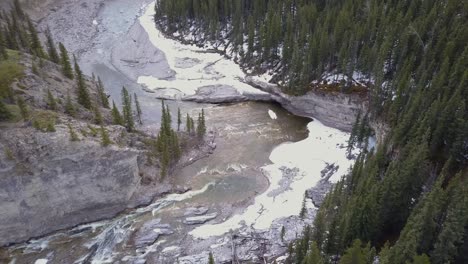 Aerial-view-of-a-boreal-river-canyon-in-spring
