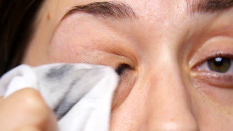 Woman-removes-eye-makeup