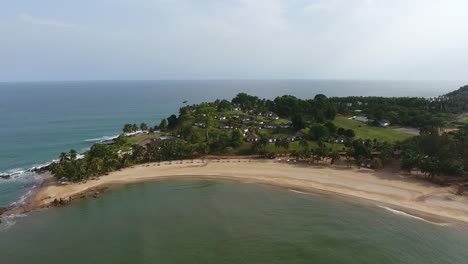 Establishing-shot-of-the-beach-resort-on-the-tip-of-Mermaids-Bay-in-Southwest-Ivory-Coast-Africa