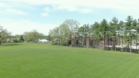 Aerial-horizontal-pan-over-a-soccer-field-with-green-grass
