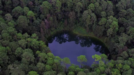 Aerial-cinematic-tilt-shot-of-a-magical-little-hidden-lake,-Montebello-National-Park,-Chiapas